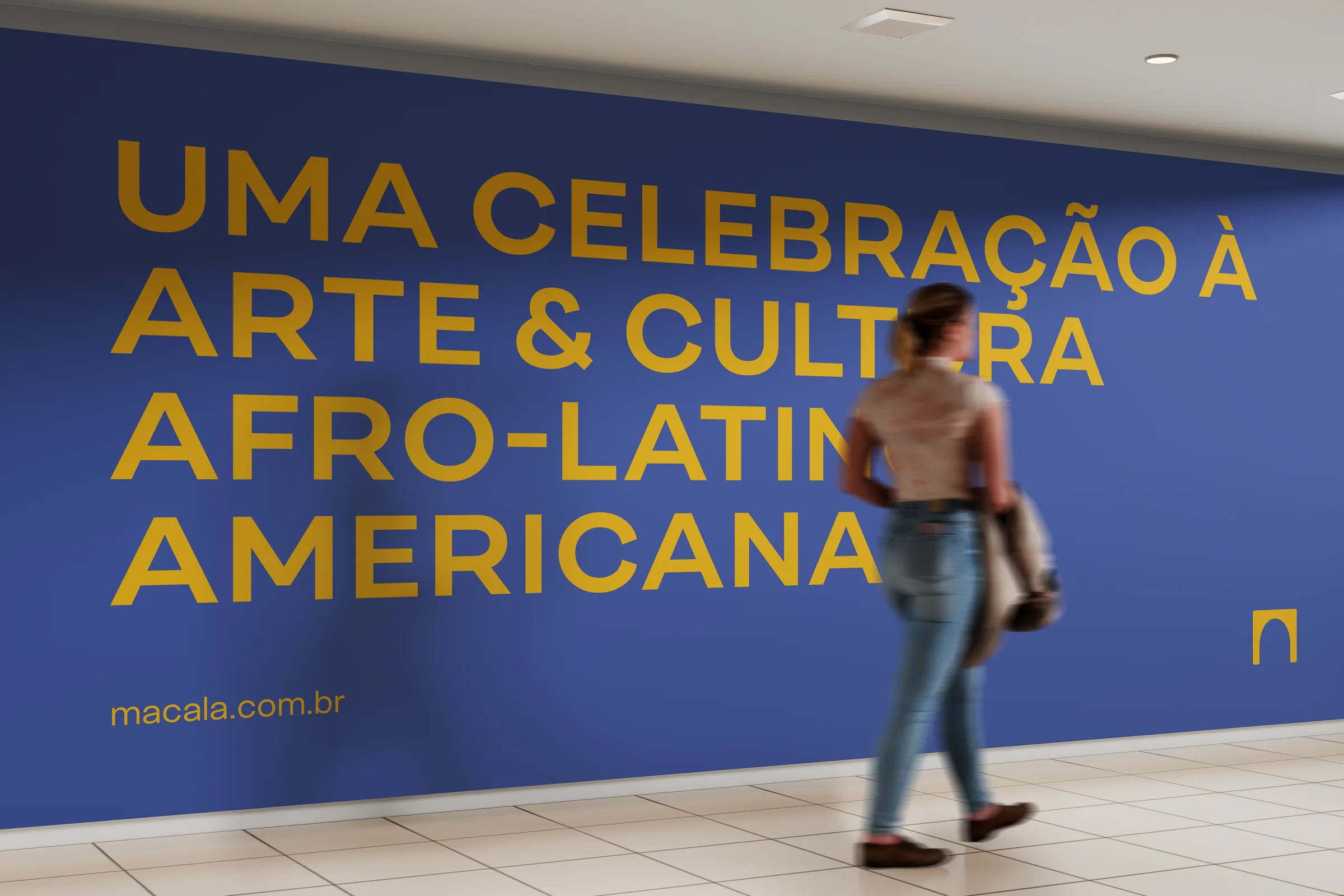 Macala wall graphic in a museum corridor